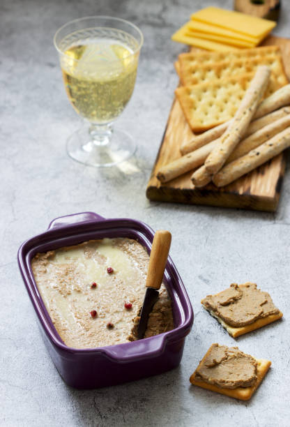 istock Chicken liver, onion and carrot paste, served with crackers, grissini and champagne. 1206643502