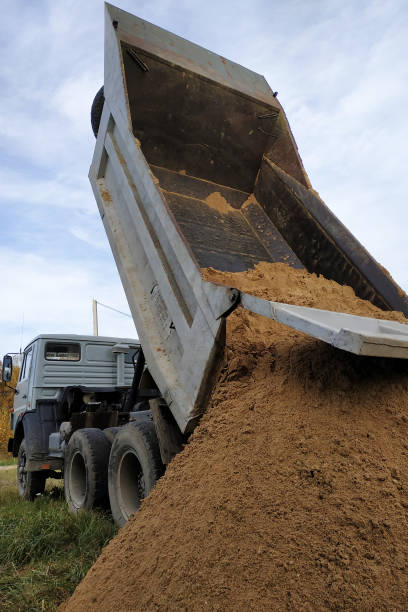 istock A dump truck unloads sand at a construction site to mix cement. 1206643577