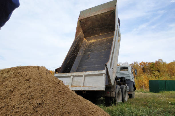 istock A dump truck unloads sand at a construction site to mix cement. 1206643630