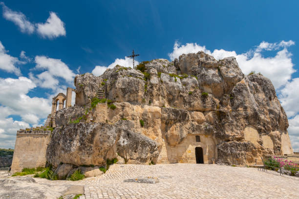 View of the church of Madonna de Idris ( Chiesa Rupestre di Santa Maria di Idris ) in the rock. Cave church in Sassi old town. Matera, Italy. View of the church of Madonna de Idris ( Chiesa Rupestre di Santa Maria di Idris ) in the rock. Cave church in Sassi old town. Matera, Italy. matera stock pictures, royalty-free photos & images