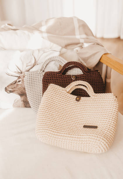 istock A collection of typical knitted ladies' bag on sofa. 1206645561