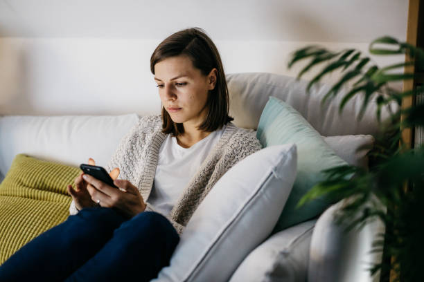 istock Woman looking at the phone 1206649719