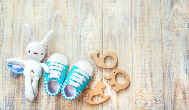 istock Baby clothes and accessories on a light background. Selective focus. 1206655763