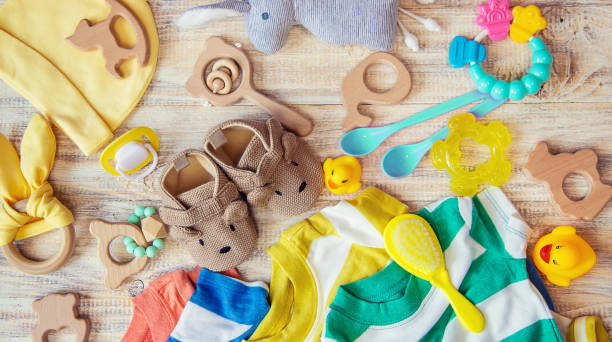 istock Baby clothes and accessories on a light background. Selective focus. 1206656916