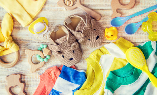 istock Baby clothes and accessories on a light background. Selective focus. 1206656932