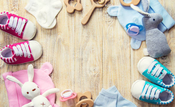 istock Baby clothes and accessories on a light background. Selective focus. 1206656997