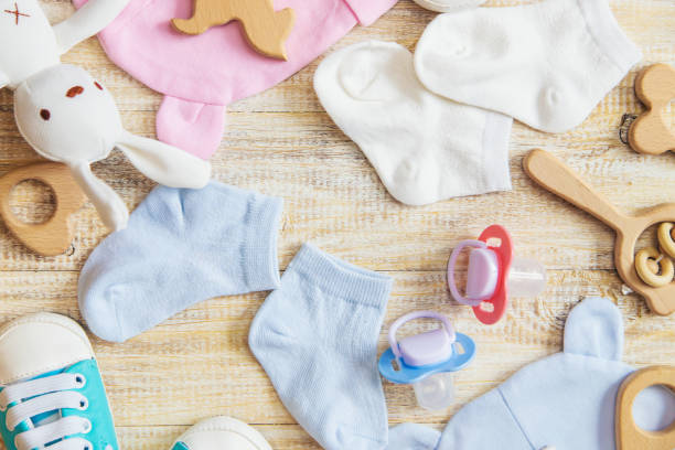 istock Baby clothes and accessories on a light background. Selective focus. 1206656998
