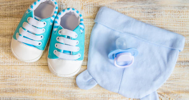 istock Baby clothes and accessories on a light background. Selective focus. 1206657002