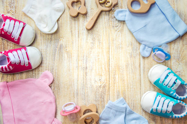 istock Baby clothes and accessories on a light background. Selective focus. 1206657029