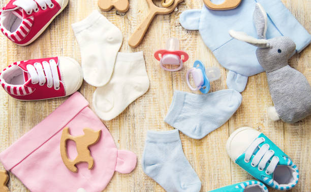 istock Baby clothes and accessories on a light background. Selective focus. 1206657078