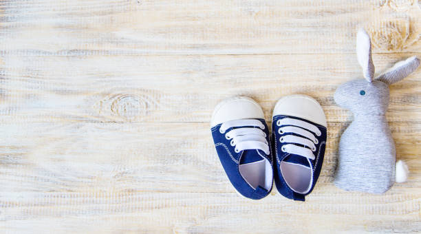 istock Baby booties and accessories on a light background. Selective focus. nature. 1206657114