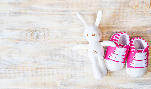 istock Baby booties and accessories on a light background. Selective focus. nature. 1206657119