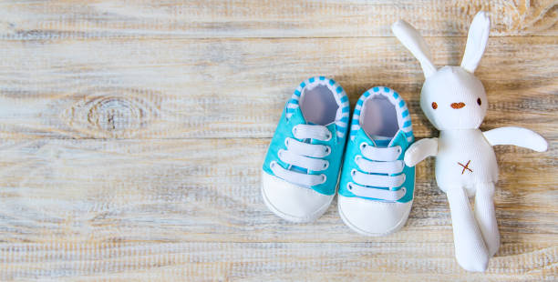 istock Baby booties and accessories on a light background. Selective focus. nature. 1206657122