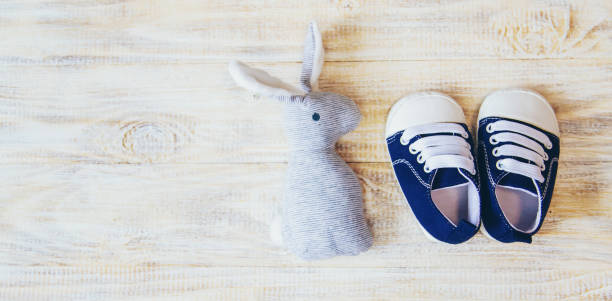 istock Baby booties and accessories on a light background. Selective focus. nature. 1206657139