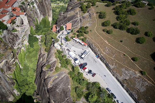 Legendary aerial drone view of ancient monasteries and breathtaking picturesque valley and landmark canyon of Meteora, Greece in summer
