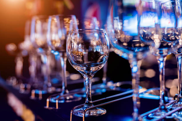 istock Wine and martini glasses in shelf above a bar rack in restaurant. 1206658746