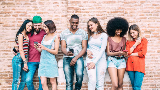 istock Happy multiethnic friends using smartphone at university college backyard - Young people on addict mood with mobile smart phone - Technology concept with always connected millennials - Filter image 1206660197