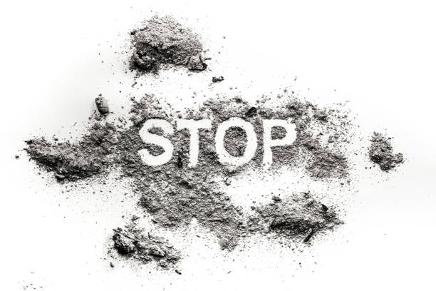 istock Stop word written in ash, dust or filth 1206661700