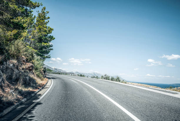 istock Country highway on a summer day. 1206664411