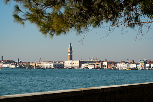 View of Ponta della Dogana and Santa Maria della Salute church dome from the Giudecca Canal at Venice, Italy. The building Dogana da Mar in Dorsoduro was built in the 15th century for customs and docking porposes and is now an art museum. It is right in the point where Grand Canal and Giudecca Canal meet and in front of the main island of Venice and it can be seen from the main island through the Grand Canal.
