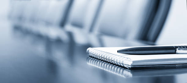 istock Notepad on a table with pen before meeting, blue tone, business concept with copy space 1206665663