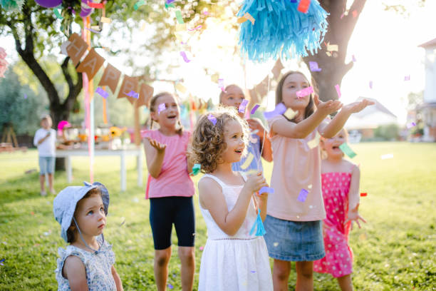 istock Small children standing outdoors in garden in summer, playing. 1206670000