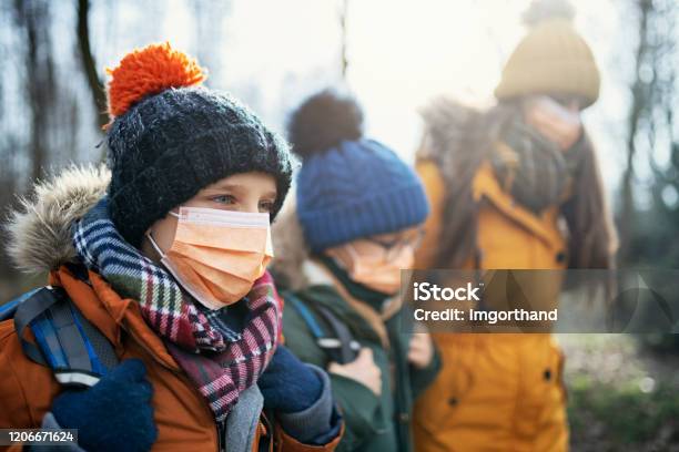 Three Kids Wearing Anti Virus Masks Going To School Stock Photo - Download Image Now