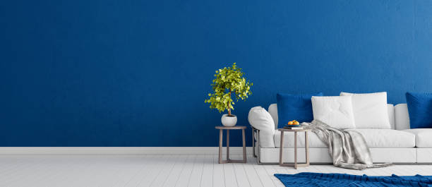 Blue concrete wall with white modern furniture, minimal interior design, 3d render Blue concrete wall with white modern furniture, minimal interior design, 3d render, 3d illustration blue house stock pictures, royalty-free photos & images