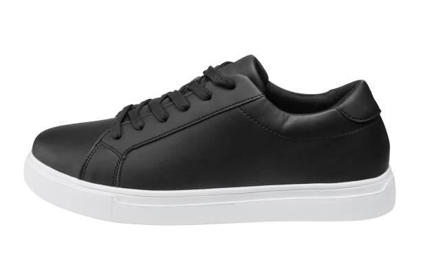 istock one black sports shoe with a white sole, on a white background 1206672962