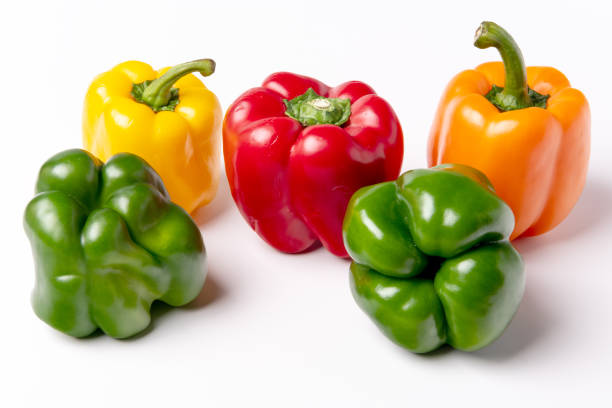 istock Unique peppers of color on a white tabletop 1206682314