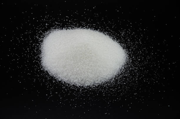 istock Spilled sugar on a black background, lot 1206682360