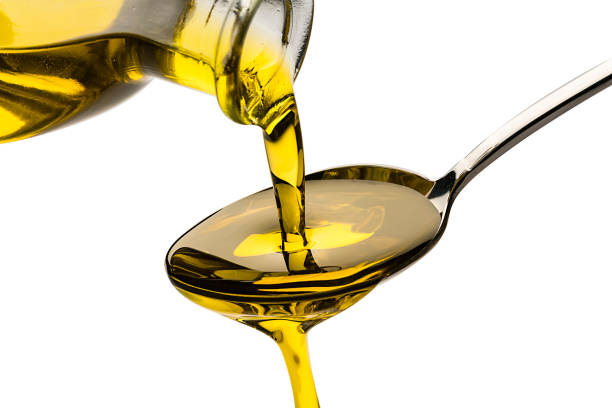 istock Pouring extra virgin olive oil 1206682710