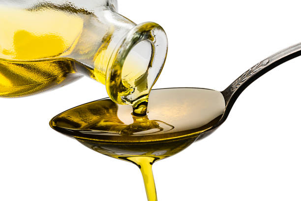 istock Pouring extra virgin olive oil 1206682723