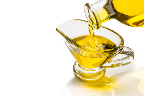 istock Pouring extra virgin olive oil in a glass bowl 1206682736