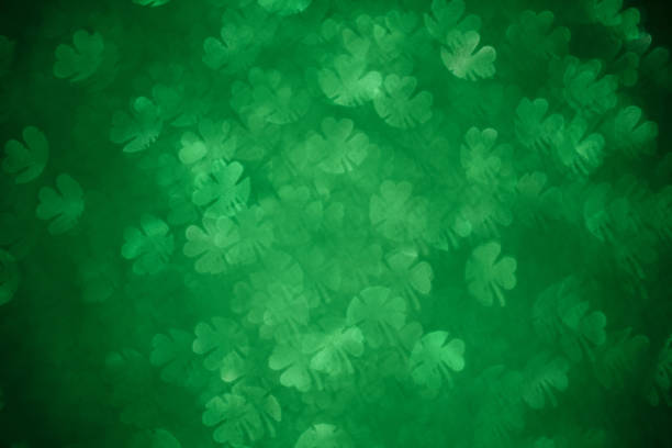 istock Clover shaped bokeh. St.Patrick 's Day. Blurred abstract background. Green shamrock 1206682832