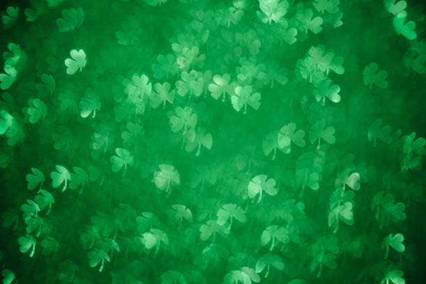 istock Clover shaped bokeh. St.Patrick 's Day. Blurred abstract background. Green shamrock 1206682887