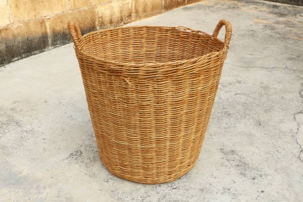 istock Empty Wicker basket on old concrete floor and brick wall. 1206685310