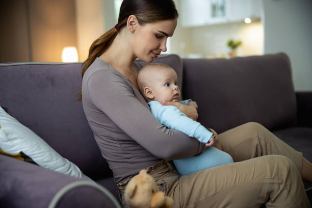 istock Pretty young mom with her little kid at home 1206692702