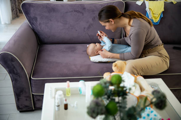istock Smiling lady treating little kid at home 1206692880