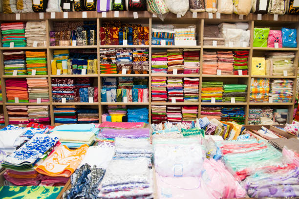 Lifestyle...This image shows several racks with carefully laid out, brightly colored, cloth fabric.