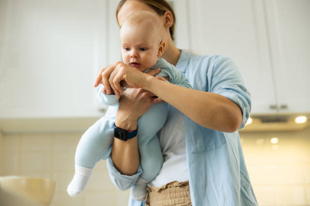 istock Young pretty lady and her baby posing at camera 1206701362