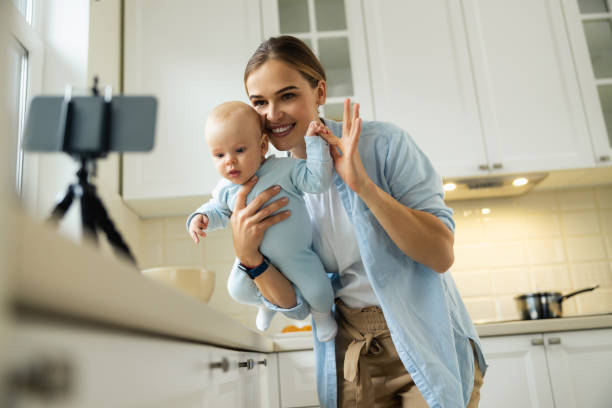 istock Happy pretty lady and her baby posing at camera 1206701380