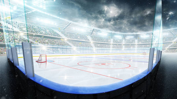 Hockey arena illuminated by spotlights. Empty sport rink. Hockey stadium at night under the moonlight. Empty field. Wide angle. Sport background Hockey arena illuminated by spotlights. Empty sport rink. Hockey stadium at night under the moonlight. Empty field. Wide angle. Sport background hockey puck photos stock pictures, royalty-free photos & images
