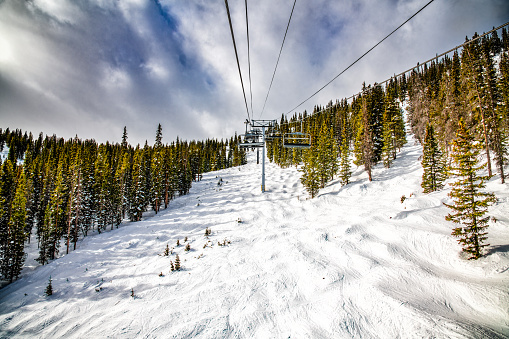 A ski lift up the side of a mountain at Winter Park, Colorado.