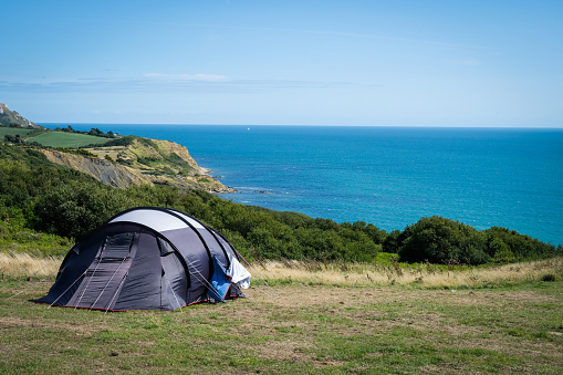 Camping tent overlooking the ocean in Osmington Mills, Dorset, England