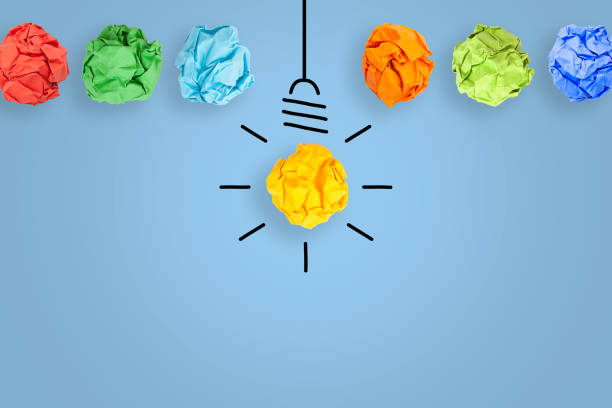 istock Idea Concepts with Light Bulb Crumpled Paper on Blue Background 1206705260