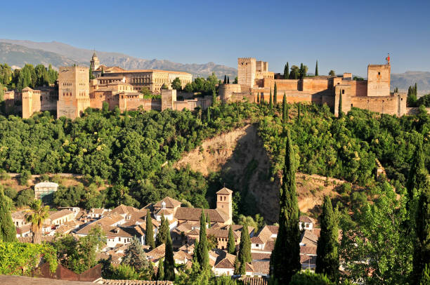 Spain Andalusia Granada View from Patio de la Acequia to Alhambra Overall view of Alcazaba City castle on the hill Sabikah. stock photo