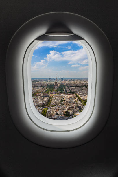 Paris France in airplane window Paris France in airplane window - travel background airplane commercial airplane propeller airplane aerospace industry stock pictures, royalty-free photos & images