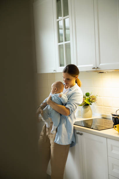 istock Young lady resting with her baby in the morning 1206709131