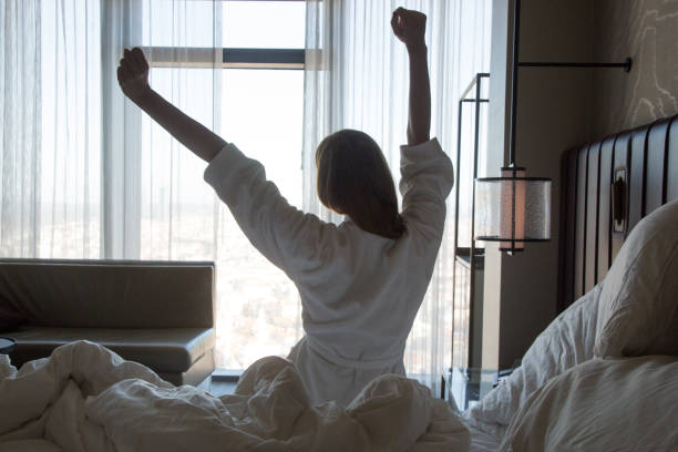 istock Upper body mobility, Beautiful young woman stretching after waking up 1206709241